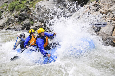 Rafters crashing through a big wave