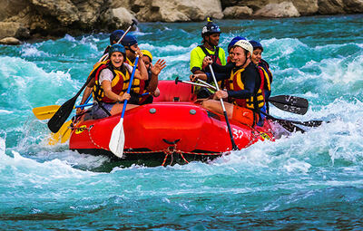 Family group enjoying a gentle rapid