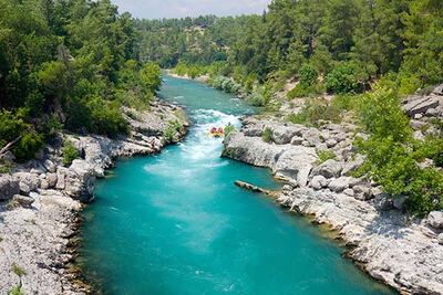 Calm river winding through a rocky canyon
