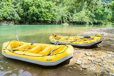 Rafts resting on the riverbank at the put-in